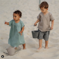 Screenshot 2022-05-01 at 11-09-35 bebeshore on Instagram “Beach look for him sand mediterranean shirt & striped linen shorts 🌾 Beach look for her sage muslin dress made of 100% organic cotton 🌾…”